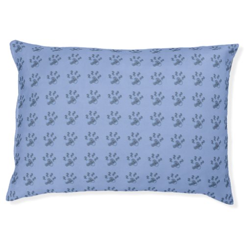 Cute pet paws on sky blue pet bed