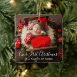 Cute Photo Elegant New Baby First Christmas Ceramic Ornament<br><div class="desc">Cute holiday birth announcement ornament featuring a simple design with "Our First Christmas as a Family of Three" in an elegant script over your favorite newborn photo. The back has a second picture along with baby's name and birth stats. Upload an ultrasound photo and add your baby's name and due...</div>