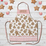 Cute Pink Christmas Cookie Baking Crew Apron<br><div class="desc">A cute holiday gingerbread cookie pattern decorates this Christmas cookie baking crew apron. Personalize it with your name. So Fun for Christmas baking! Border of apron has a pink and white polka dot pattern with ric rac. Makes a fun gift for Christmas. Designed for you by Blackberry Boulevard.</div>