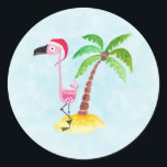 Cute Pink Flamingo in a Santa Hat Tropical Xmas Classic Round Sticker<br><div class="desc">Stickers with a cute illustration of a pink flamingo wearing a red santa hat. Standing on a mound of sand with a tropical palm tree behind. Light blue background.</div>