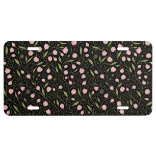 Cute, pink flower on black with repeating pattern  license plate