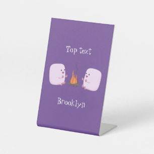 Cute pink marshmallows by camp fire cartoon pedestal sign