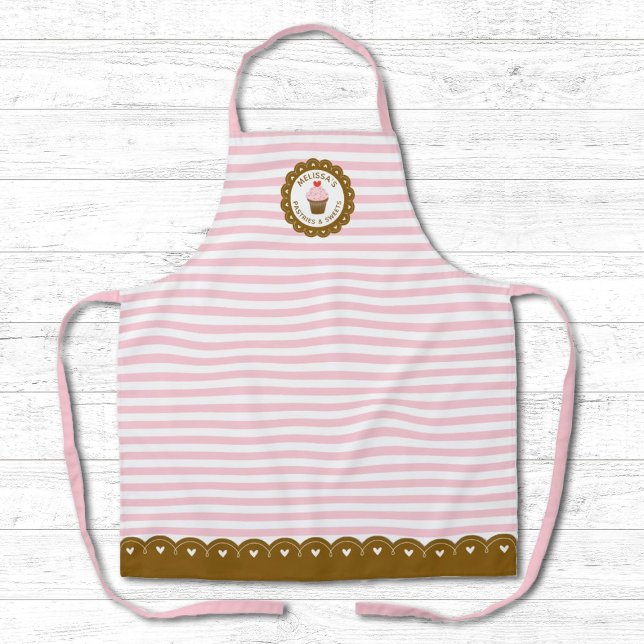 Cute Pink Striped Cupcake Baking Apron (A cute pink and white striped bakery apron decorated with a cupcake. Personalize it with your name!)