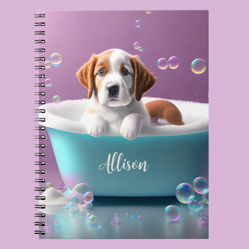 Cute puppy in a bathtub with soap bubbles notebook