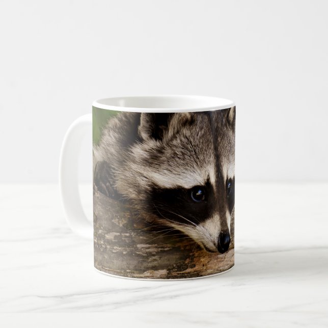 Cute Raccoon Resting on a Log Coffee Mug (Front Left)