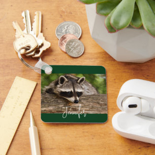 Cute Raccoon Resting on a Log Keychain