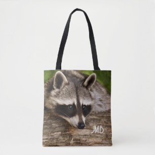 Cute Raccoon Resting on a Log Tote Bag