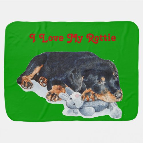 cute rottweiler puppy cuddling gray teddy bear dog stroller blanket