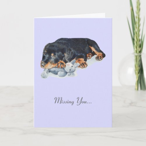 cute rottweiler puppy dog with teddy missing you card