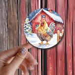 Cute Rustic Rooster Farm Themed Christmas Classic Round Sticker<br><div class="desc">Cute Christmas stickers with a farm theme. Red rustic barn and a chicken standing on a red fence.</div>