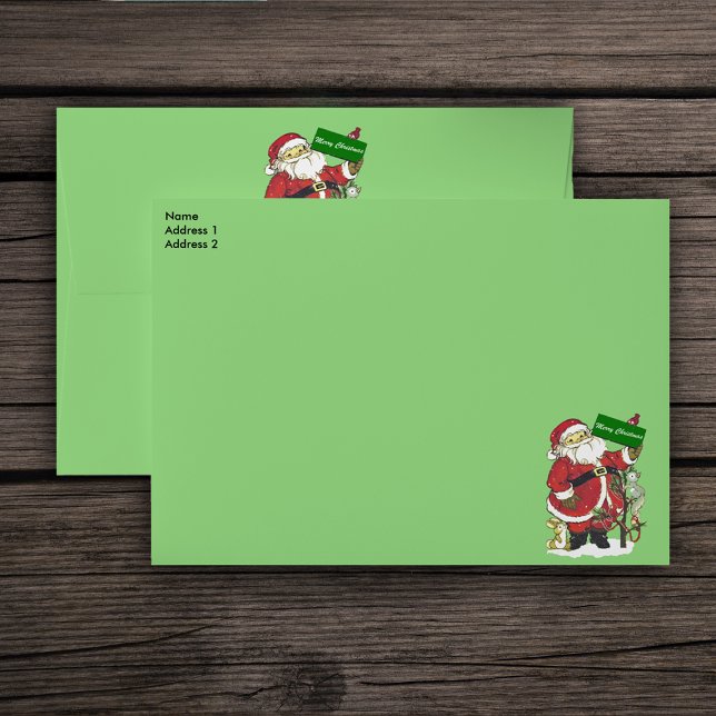 Cute Santa Animals Merry Christmas Envelope (Santa Clause with Merry Christmas sign surrounded by animals and tree on green mailing envelopes.)