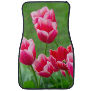 Cute scarlet tulips in the garden car floor mat