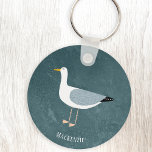 Cute Seagull Name Keychain<br><div class="desc">A cheeky seagull standing by the ocean. Perfect for those who love sassy birds and the coast.
Personalize by changing or removing the name.</div>