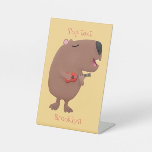 Cute singing capybara ukulele cartoon illustration pedestal sign