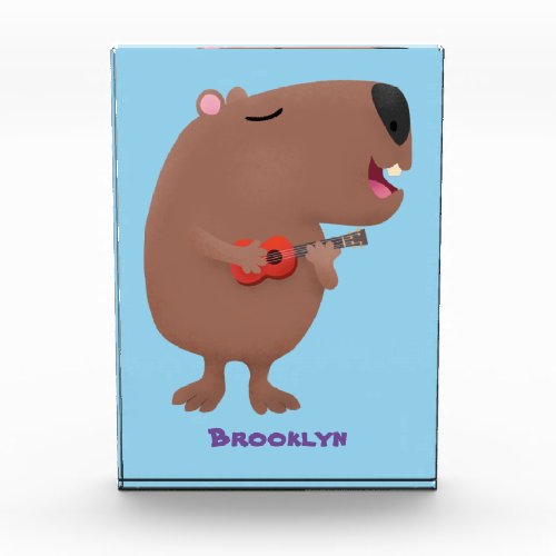 Cute singing capybara ukulele cartoon illustration photo block