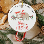 Cute Slothy 1st Christmas Kids Ceramic Ornament<br><div class="desc">Mark your little ones first Christmas with this cute Sloth ornament. Design features a sleepy winter sloth asleep on a lit up tree brance,  the text 'slothy christmas' and name.</div>