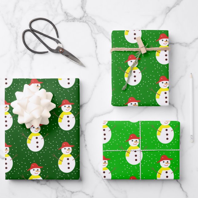 Cute snowman and snow on green wrapping paper sheets (Front)