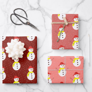 Cute snowman and snow on red wrapping paper sheets