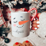 Cute Snowman Christmas Coffee Mug<br><div class="desc">This custom snowman mug makes the perfect personalized Christmas gift. It features a cute snowman face with your name. This hot chocolate or coffee mug is perfect for your children,  grandkids or friends. Give as a secret Santa or office gift.</div>