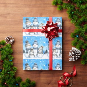 Cute snowman family in the snow wrapping paper