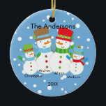 Cute Snowman Family of 4 Christmas Ornament<br><div class="desc">Our family of 4 christmas ornament features a cute snowman couple set on a snow filled blue background!   Personalize with your information and date and you're all set to go!  Wonderful dated keepsake gift for your first christmas and a great addition to you christmas ornament collection.</div>