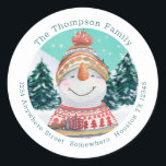 Cute Snowman Return Name Address Teal Christmas Classic Round Sticker<br><div class="desc">Add some colorful festive cuteness to your Holiday mailings with this charming snowman and snow covered forest watercolor illustration within a circular shape,  with your name curved above and your return address curved below.   All the text can be easily personalised.</div>