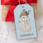 Cute Snowman Snowflakes Kids Name Christmas Gift Tags<br><div class="desc">Cute Snowman Snowflakes Kids Name Christmas Gift Tags. Reindeer Christmas holiday gift tag for children. Christmas present gift tag - personalize it with child`s name. The tag has a cute happy snowman. The background is blue with beautiful white snowflakes in different sizes and shapes. Make your Christmas gifts for kids...</div>