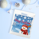 Cute Snowman Winter Wonderland Merry Christmas Favor Bag<br><div class="desc">Experience the joy of giving with our personalized Christmas favor bag. This charming favor bag, adorned with a jovial snowman set against a serene blue backdrop, captures the magic of a white Christmas. Each snowflake surrounding the snowman adds a touch of winter wonder, making it an enchanting sight to behold....</div>