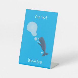 Cute sperm whale blowing bubbles cartoon pedestal sign