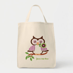 Cute spring owl holding a flower in her beak tote bag