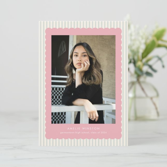 Graduation announcement card with pink scalloped design and striped background with a photo of the graduate. 
