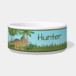Cute Triceratops Dinosaur Tropical Forest And Name Bowl<br><div class="desc">Destei's original cartoon illustration of a cute brown color Triceratops dinosaur standing in a tropical world including a blue sky,  trees,  some plants and green grass. There is also a personalizable text area for a name or other custom text.</div>