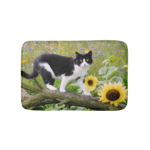 Cute tuxedo cat on a tree branch with sunflowers _ bath mat