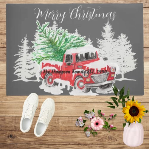 Cute vintage red truck in the snow family name doormat