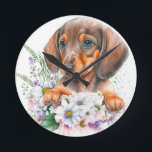 Cute Watercolor Floral Dachshund Puppy Dog      Round Clock<br><div class="desc">This gorgeous clock design features an a cute watercolor Dachshund puppy dog, with a floral arrangement consisting of some lavender sprigs and a variety of pretty flowers: mainly white. It is modern, trendy, and cute. Those who love doxies, or sausage dogs will find it utterly charming! A unique gift for...</div>