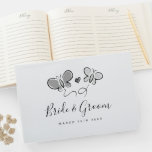 Cute wedding guest book with playful butterflies