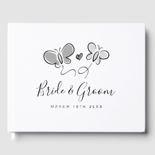 Cute wedding guest book with playful butterflies