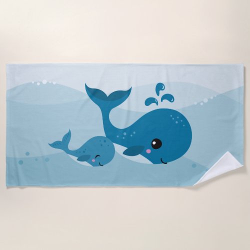 Cute whales swimming in the sea beach towel