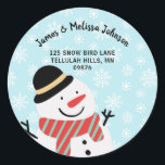 Cute Winter Snowman Return Address Classic Round Sticker<br><div class="desc">Give your holiday mailings a bit of winter wonderland with this cute snowman round return address stickers. The background includes snowflakes falling from the sky. The handsome snowman where's a black hate and red and blue scarf. The modern text you see for your name and address are templates for you...</div>