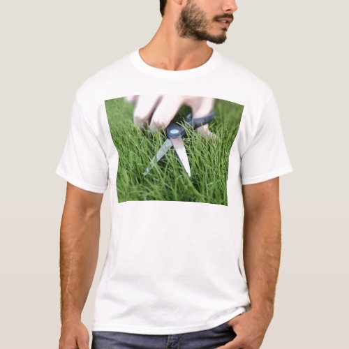Cutting the grass with a pair of scissors T_Shirt