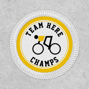 Cyclist on his bike yellow, black champs patch
