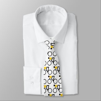 Cyclist riding his bicycle black and yellow neck tie
