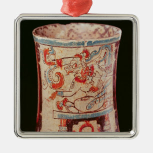 Cylindrical depicting a deity with speech curls metal ornament