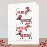 Dachshund Dogs in Santa Hats Christmas  Note Card<br><div class="desc">Adorable little Christmas Dachshund Wiener or Sausage dogs in cosy winter knitwear and Santa hats.  Customize by changing the greetings on the front and inside,  and change or remove the names.</div>
