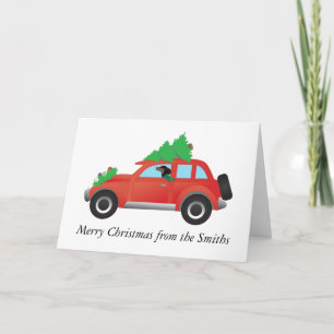 Dachshund driving: car w/ a Christmas tree on top Holiday Card
