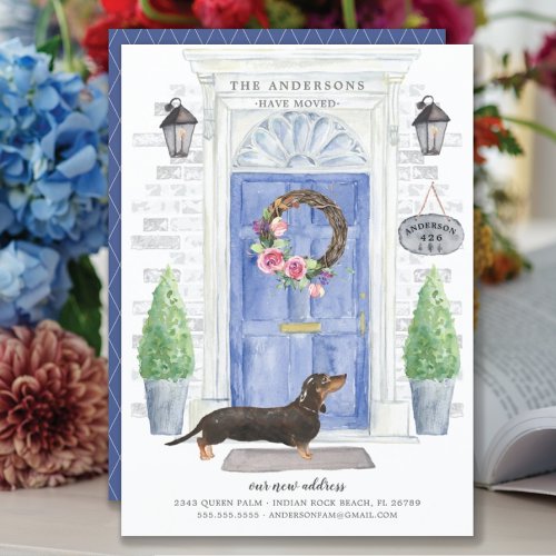 Dachshund Front Door Moving Announcement - Announce your new address with our stylish announcement featuring a Dachshund, blue front door, welcome mat, slate sign, topiaries and a floral wreath set on a gray brick background.