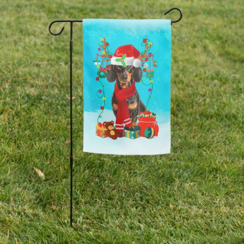 Dachshund in snow with Christmas gifts  Garden Flag