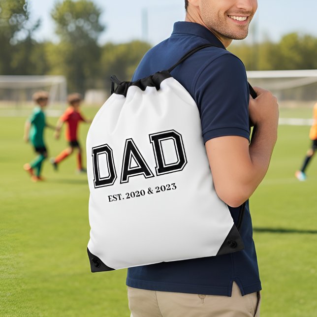 Dad Established Simple Modern College Typography Drawstring Bag (Dad Est. Year(s) design with bold college athletic style black text - fully personalizable)