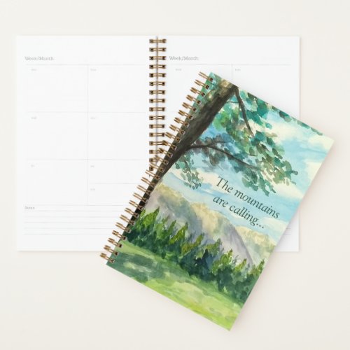 Daily planner with watercolor painting of mountain