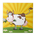 Dairy Cow Ceramic Tile<br><div class="desc">Dairy Cow With Flower In Mouth On A Meadow And Sunburst</div>